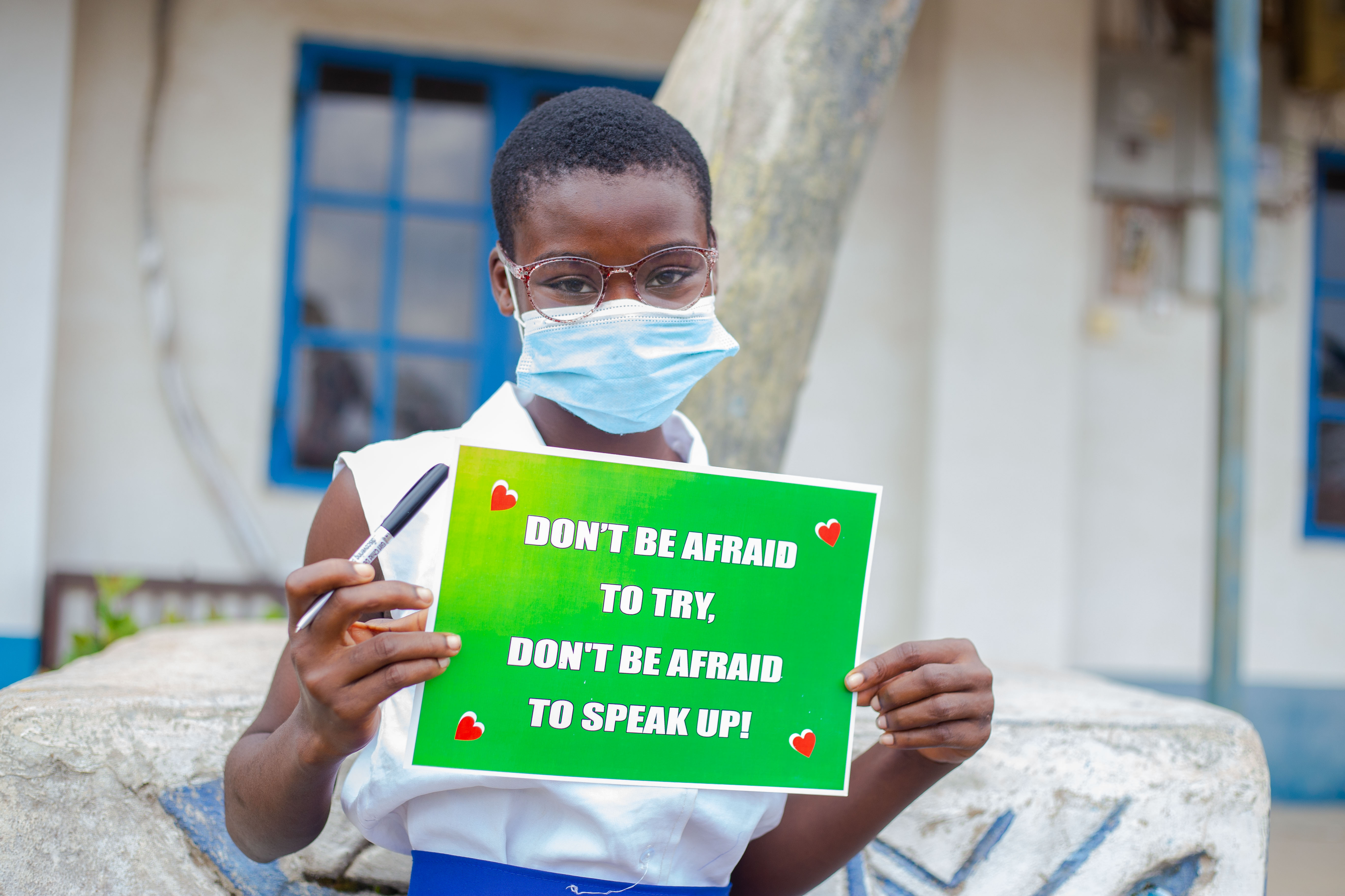 A girl holds her favourite placard at the IDG2021 symposium in Ibadan. Photo credit: Gloria Jane. 